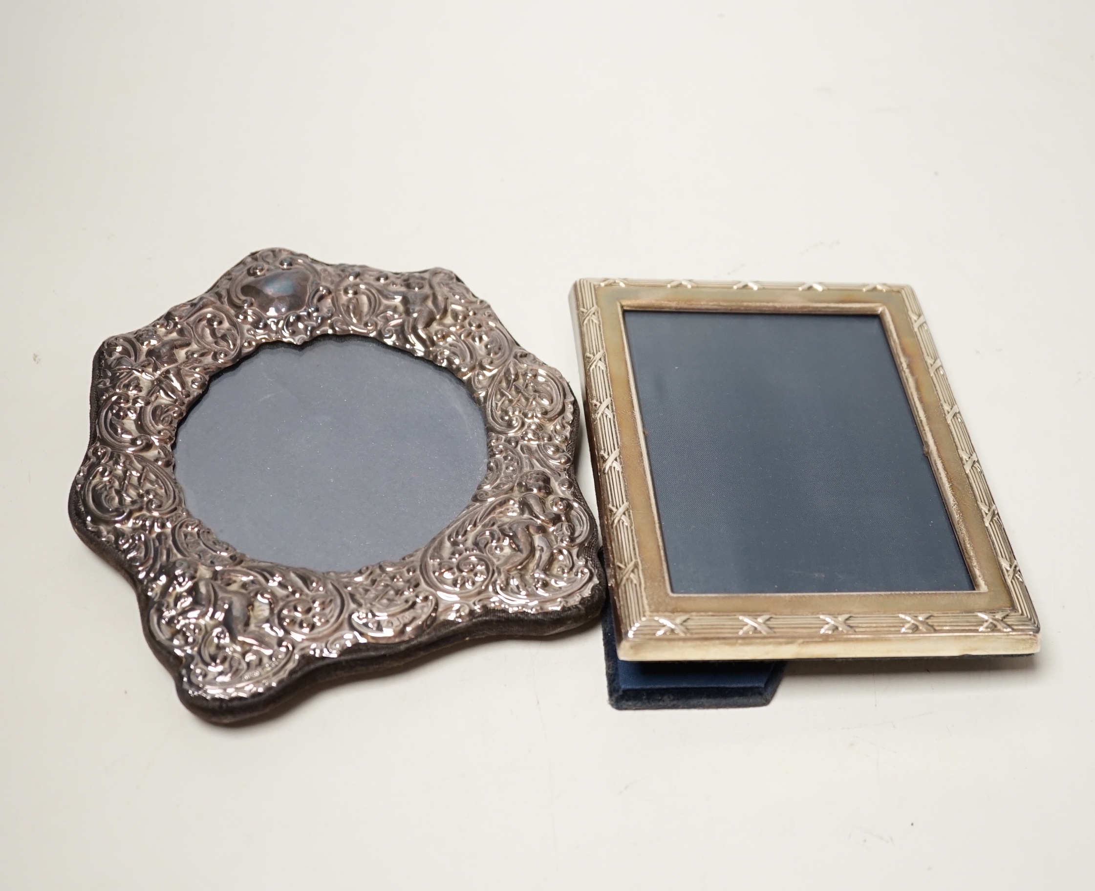 Two modern repousse silver mounted photograph frames, largest 17cm.